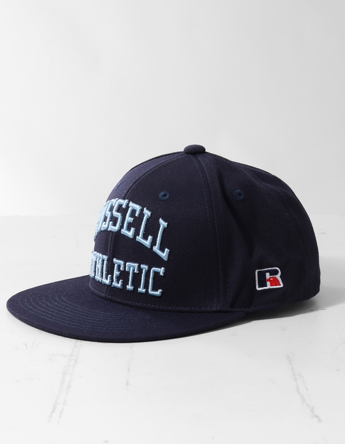 Accessories Čepice Russell Athletic Arch Logo Snap Back 3D Embroidered Tmavě Blankyt | KNF-374691